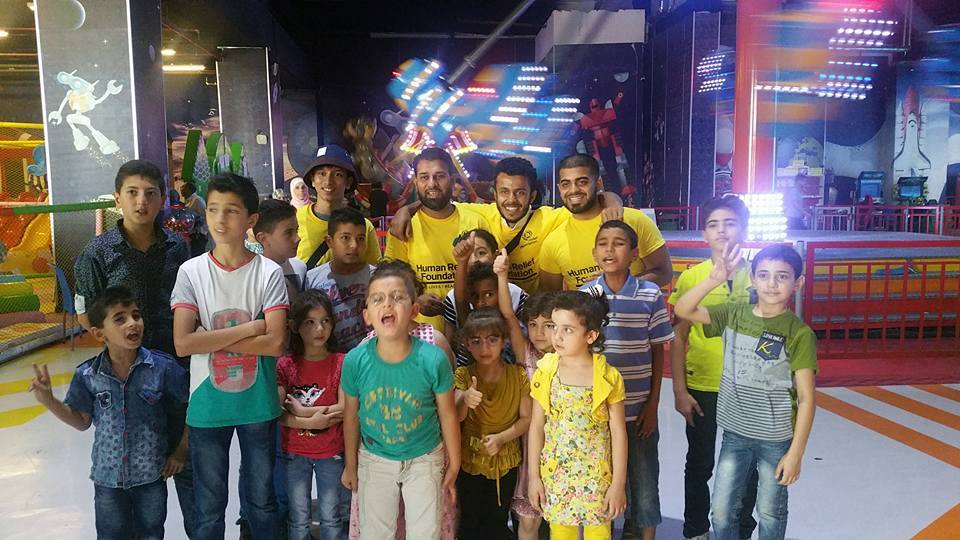 Volunteers with Fundraising Manager Khoyrul Shaheed from HRF in Jordan taking Orphans to purchase Eid Gifts.