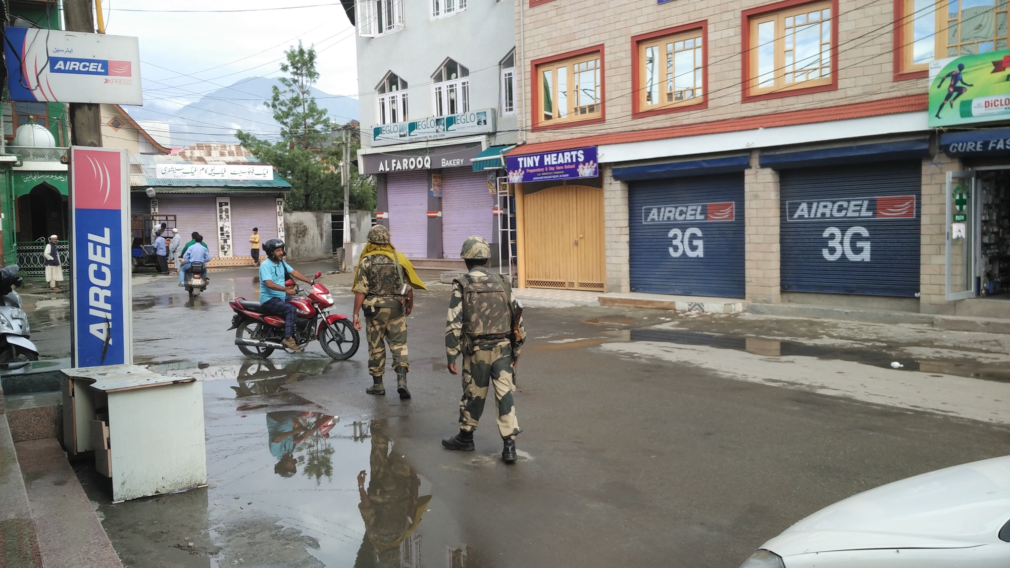 Security forces patrolling the deserted streets.